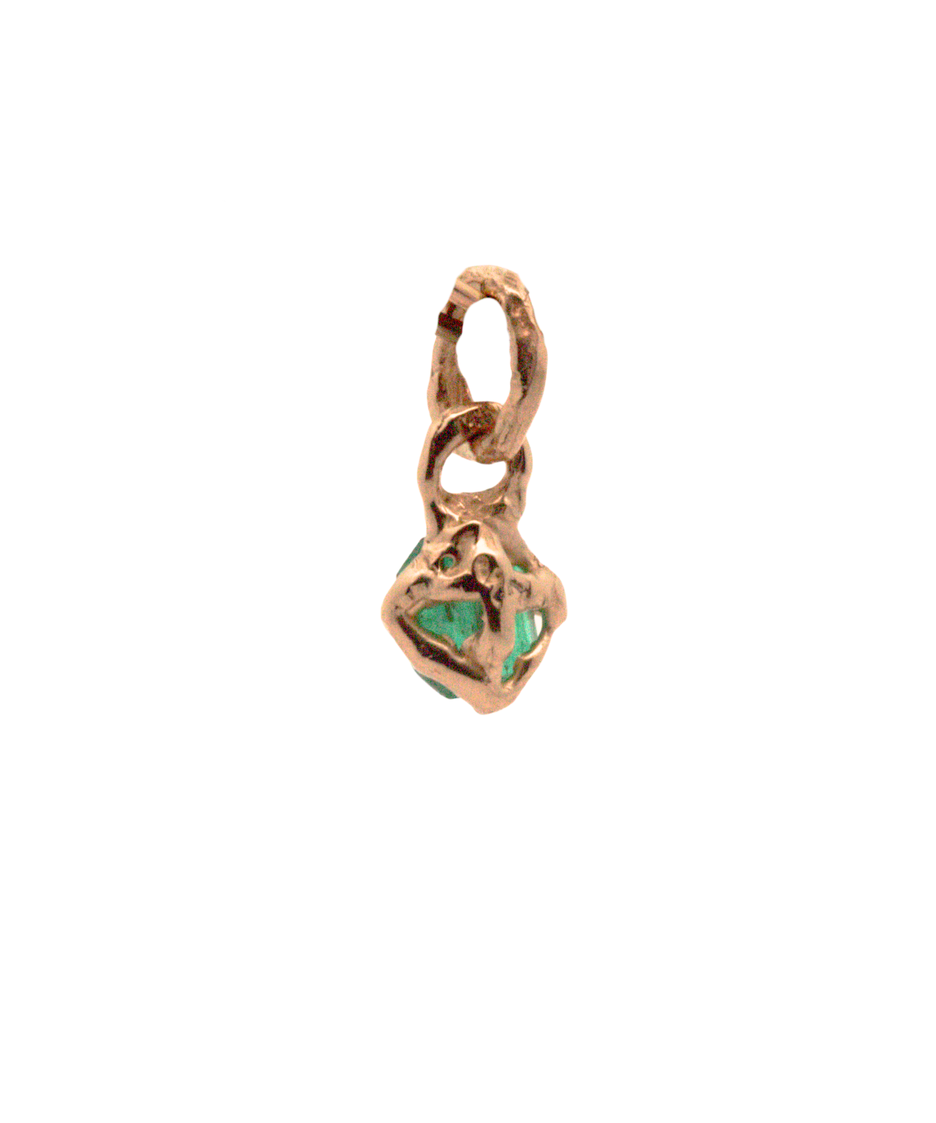 Close-up of Hand-Carved Emerald Charm with Sculptural Design