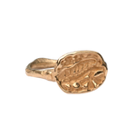 Close-up of Hand-Carved FRIKA Ring Featuring Fossil Fern and Floral Design

