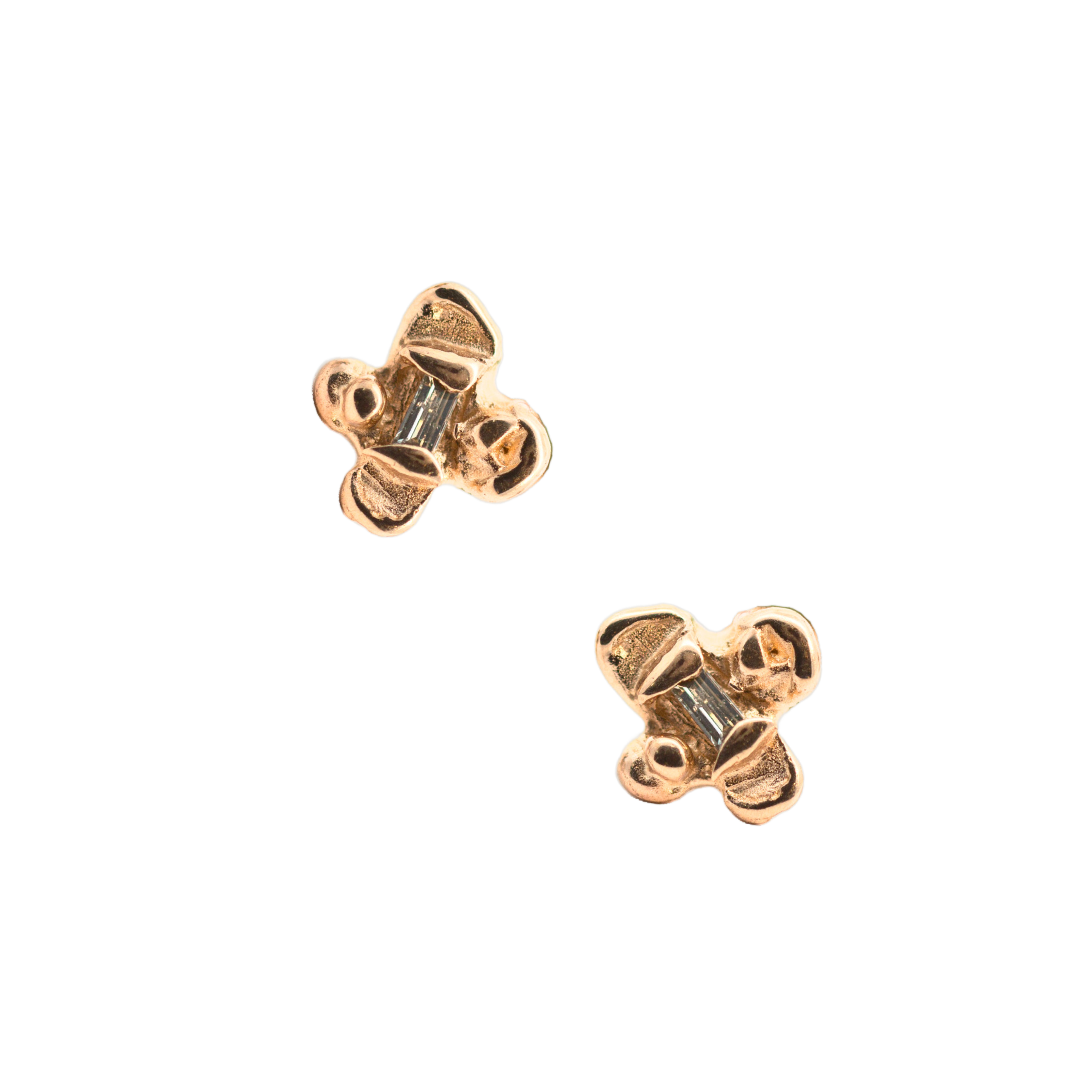 Close-up of Hand-Carved IDUN Earrings Featuring Four-Petal Flower Design