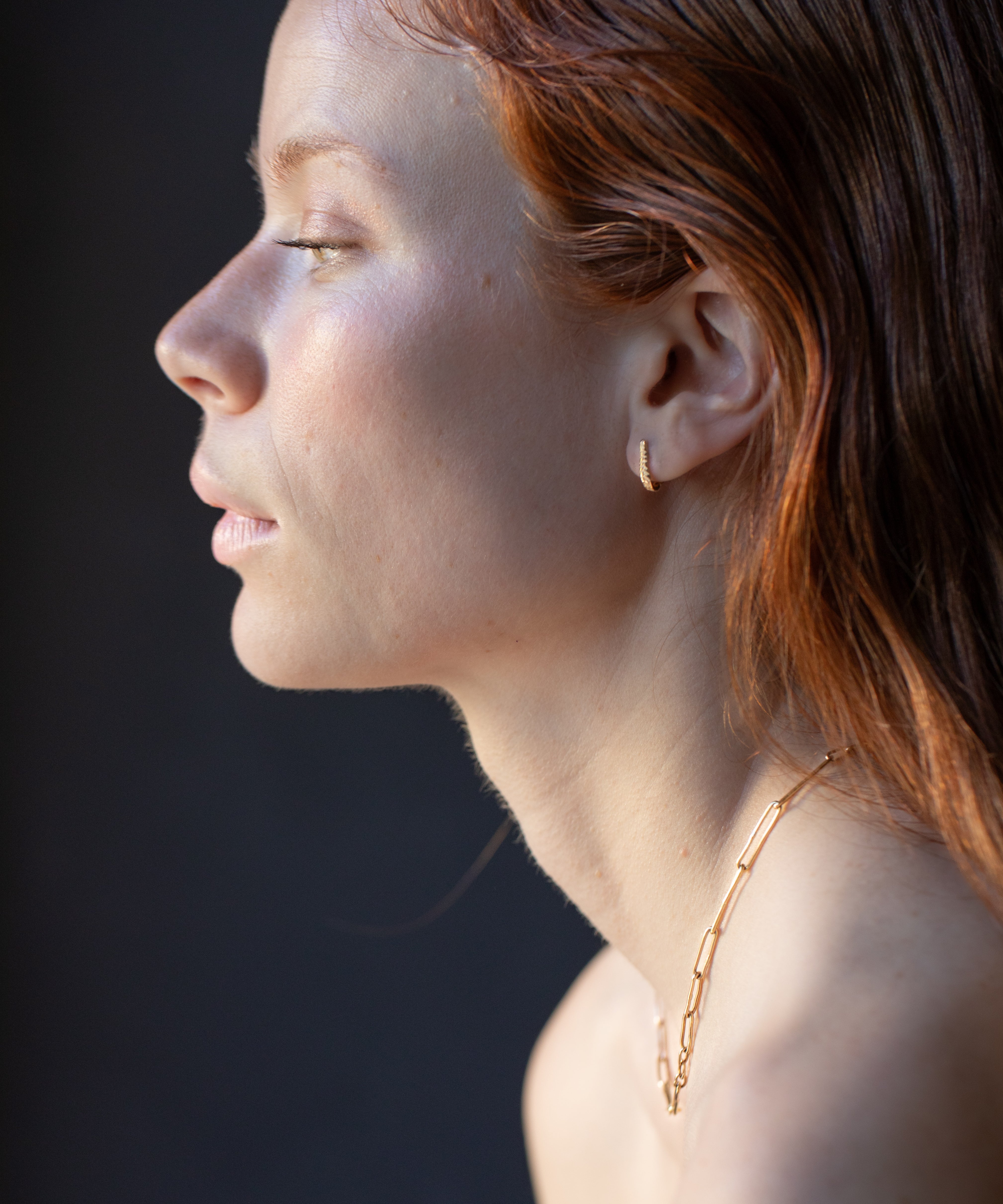Close-up of Hand-Carved JONSI Necklace Showcasing Textured Finish