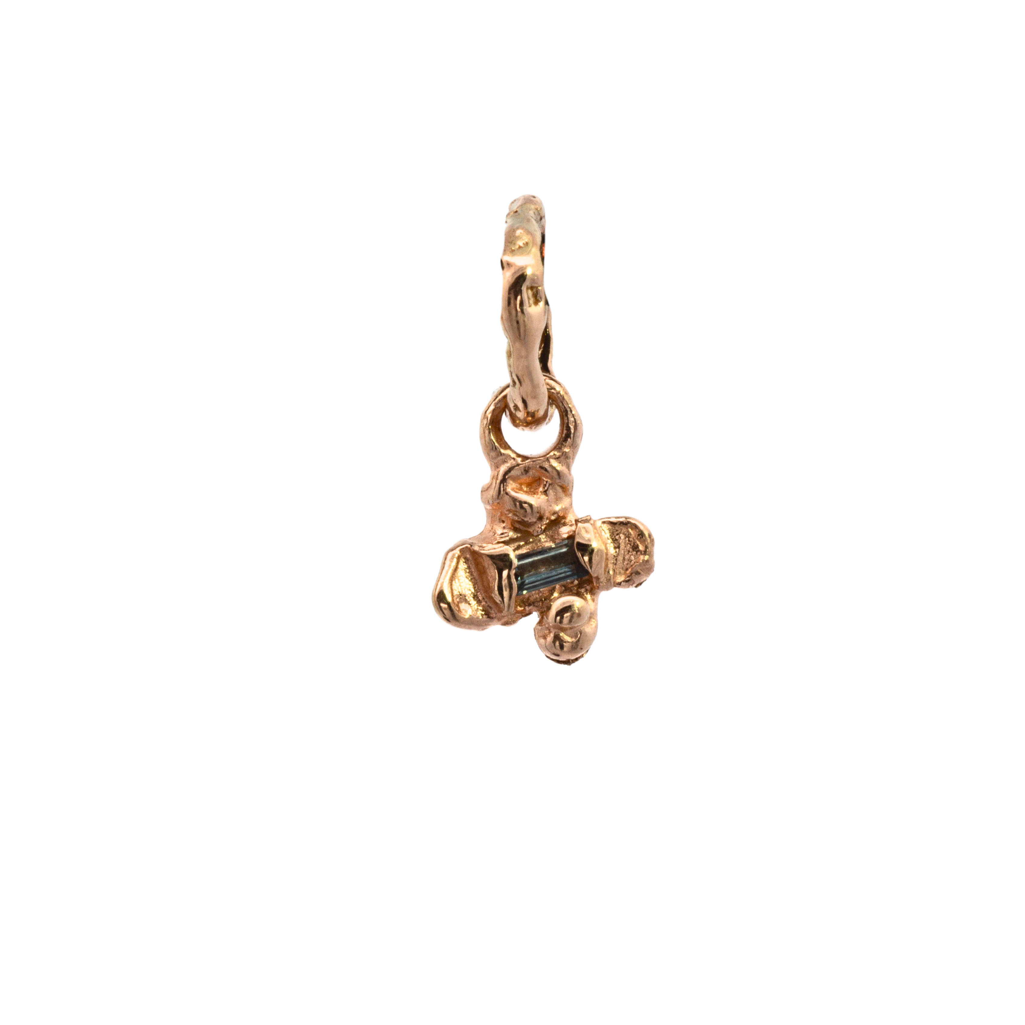 Close-up of IDUN charm showcasing hand-carved floral details