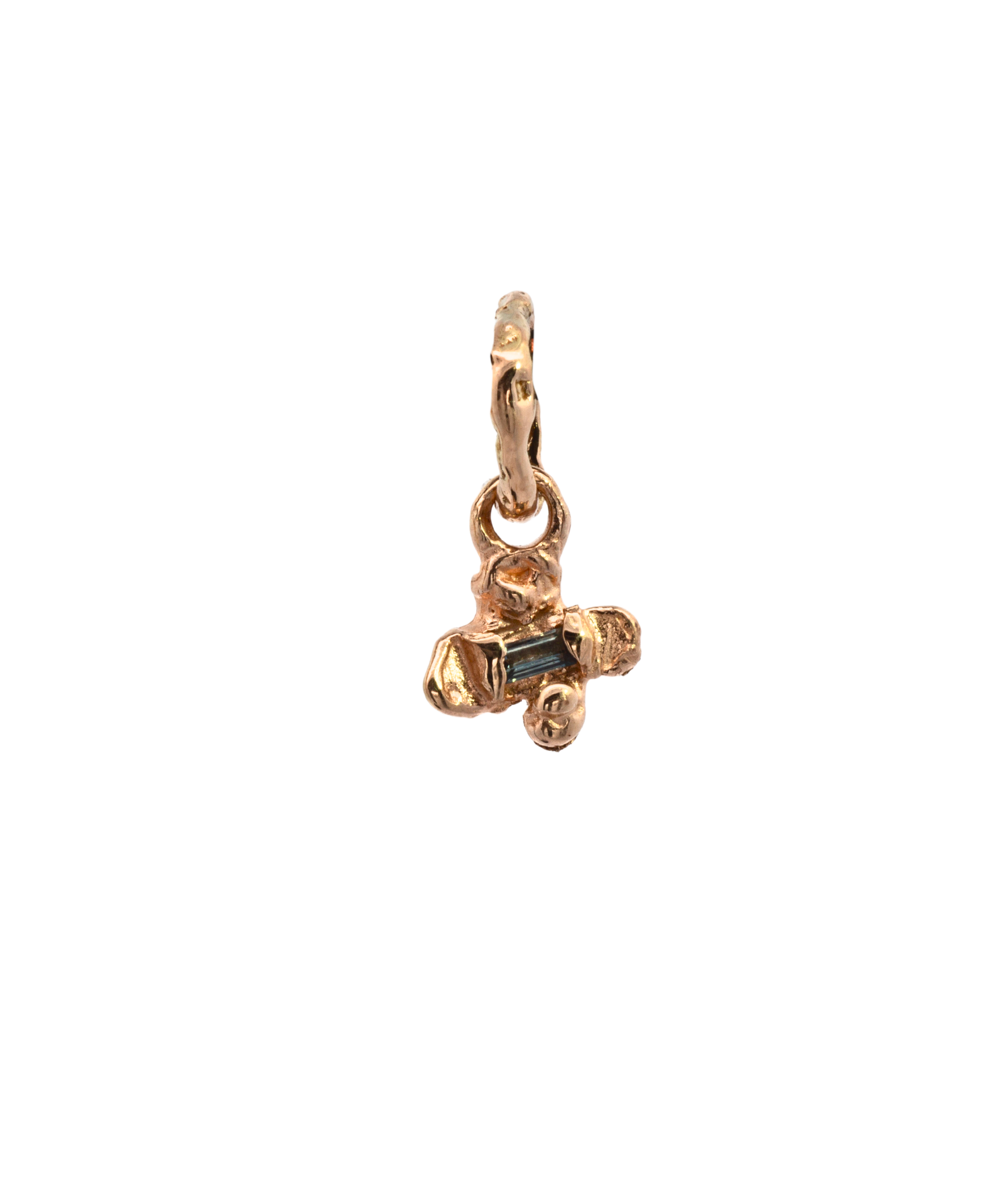 Close-up of IDUN charm showcasing hand-carved floral details