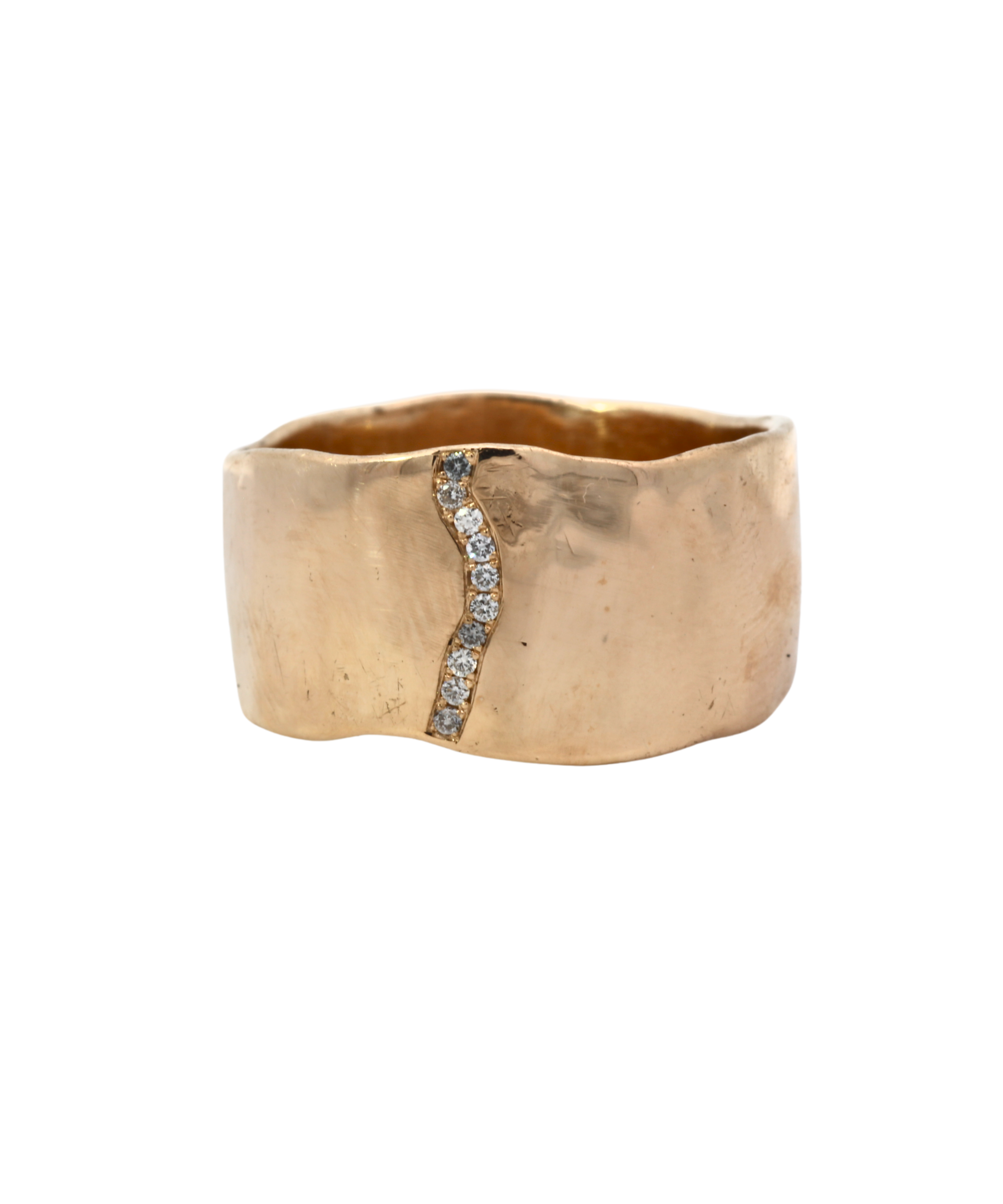 Close-up of SIGR WATER ring showcasing wavy edges and hammered texture