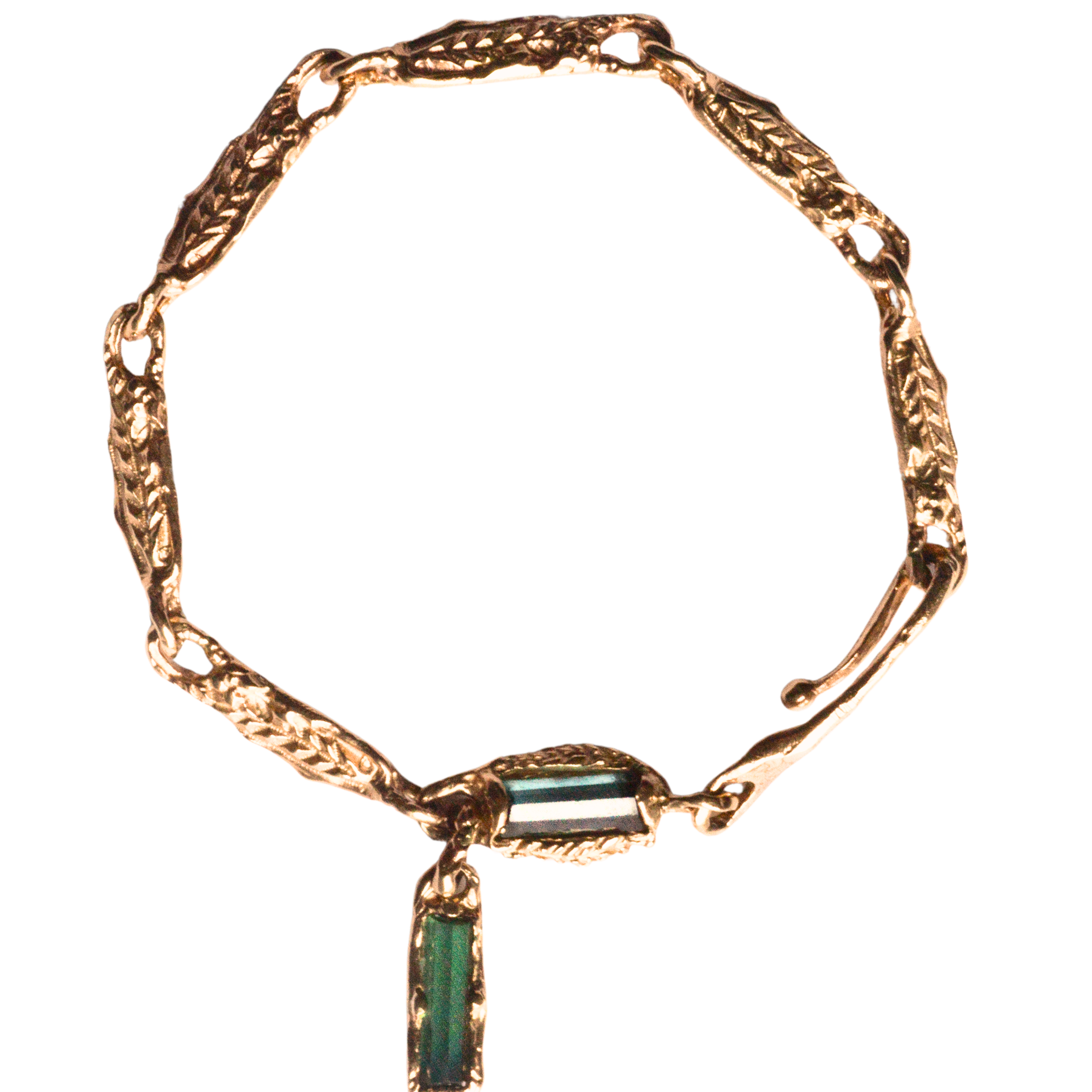 Golden fern link bracelet in 14 k gold with green tourmalines.