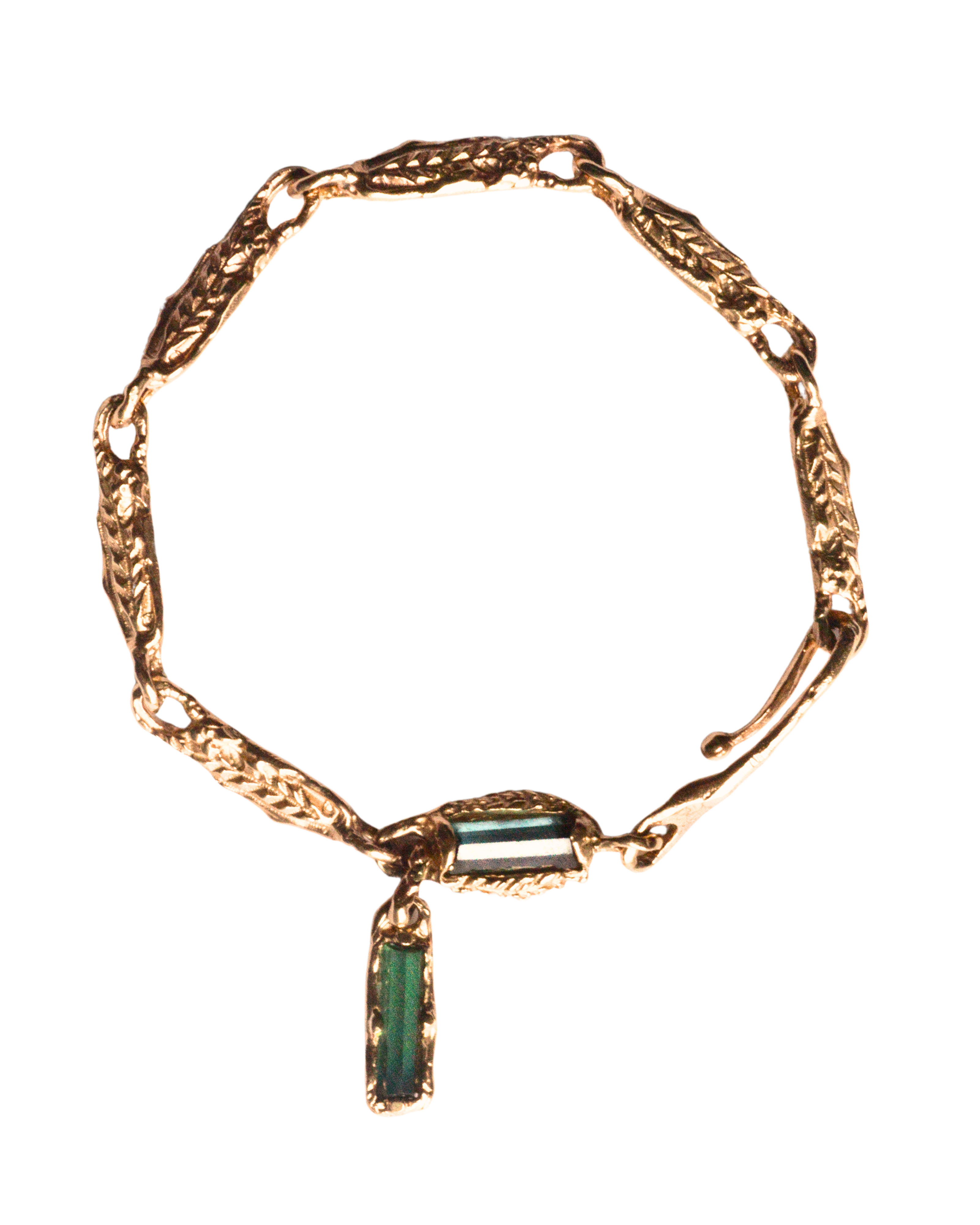 Golden fern link bracelet in 14 k gold with green tourmalines.