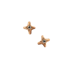 Gold star stud earrings with diamond center on black background