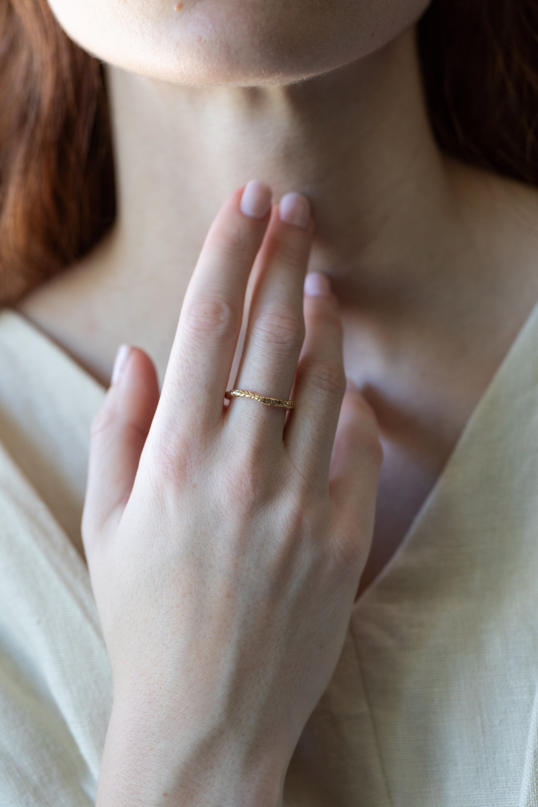 hand-carved fern ring cast in 14k gold with hammered texture