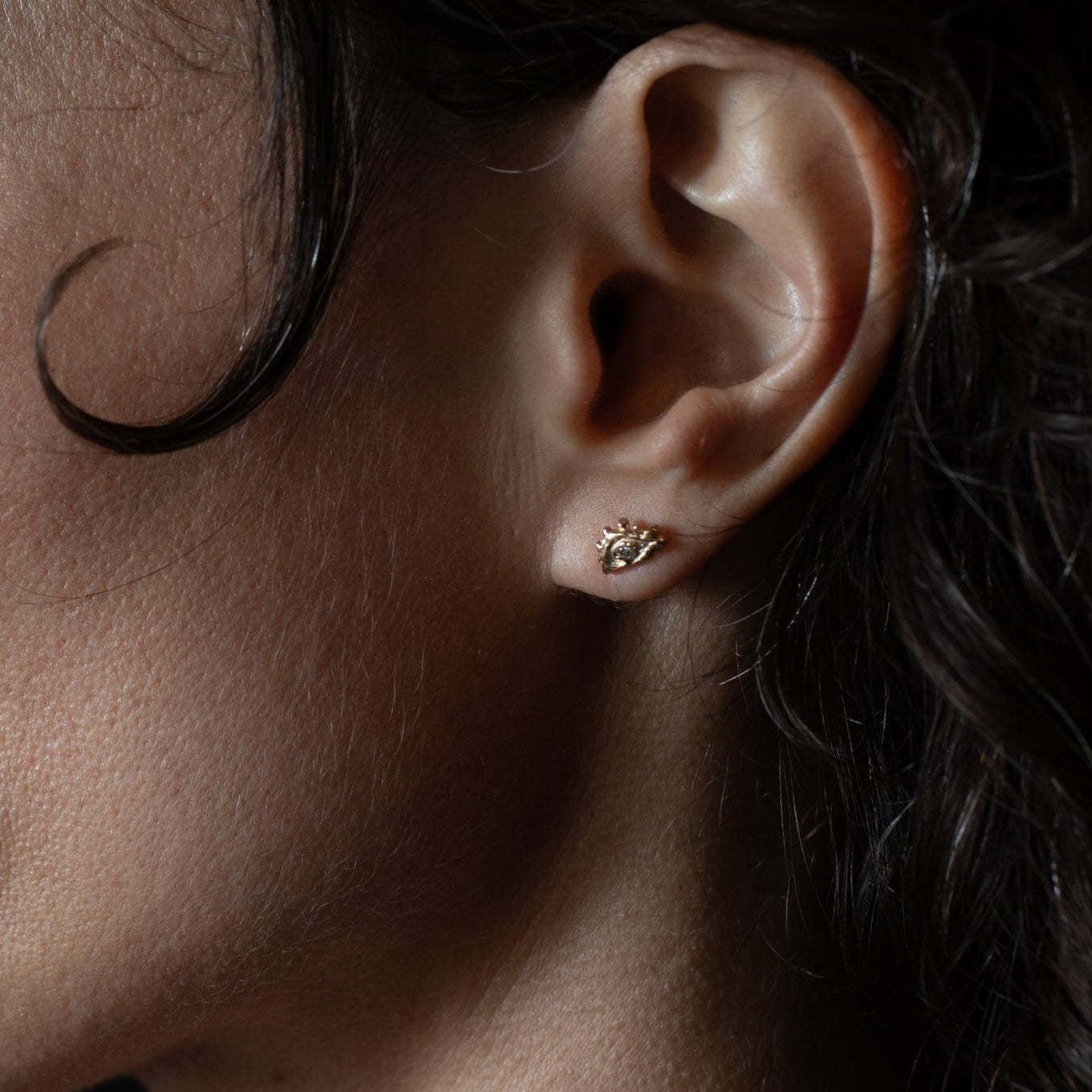 Diamond EYE Stud Earring Single texture close-up showing lost wax cast detail, 14K Fairmined gold