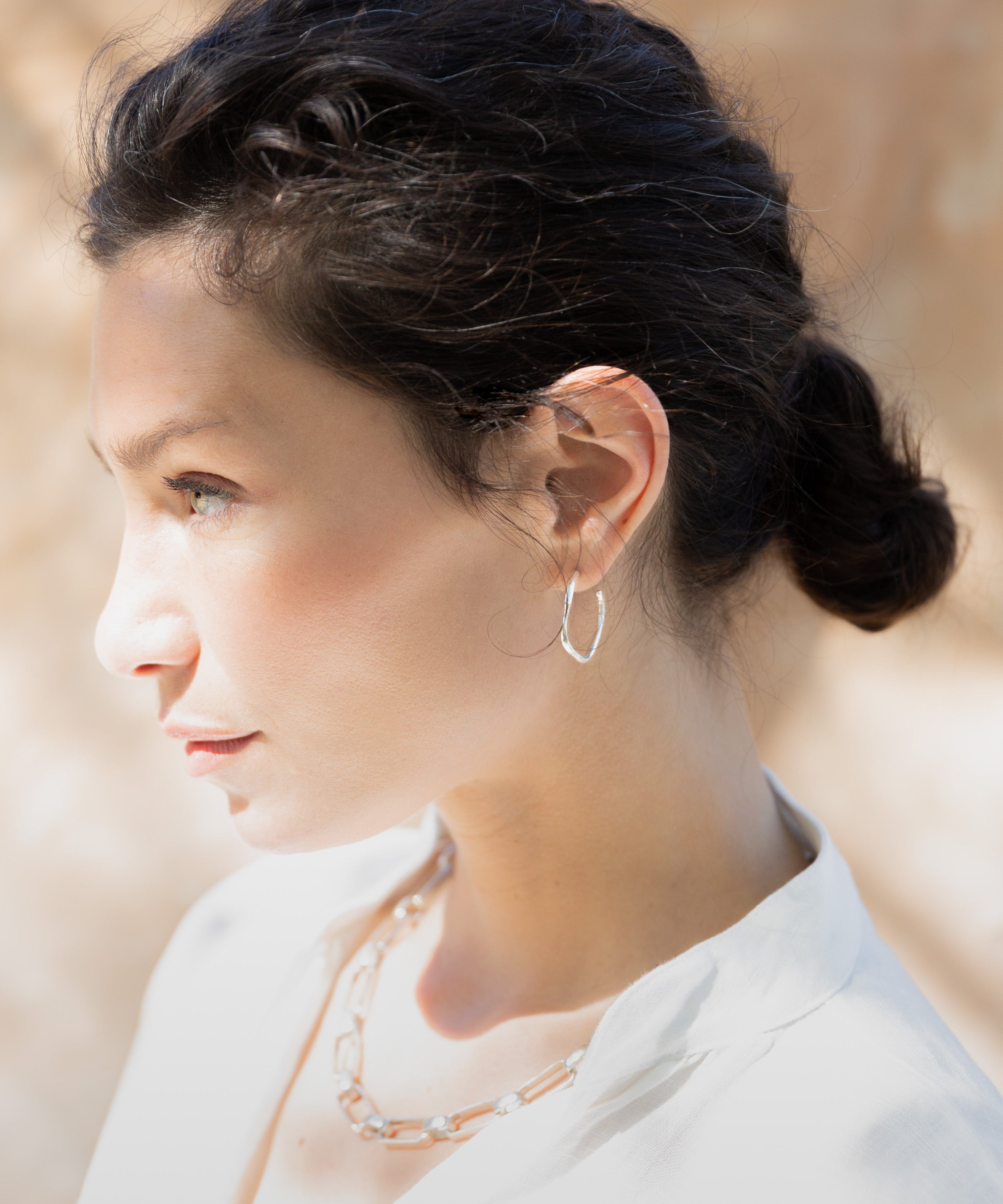 MADRONE Hoop Earrings worn on ear, sculptural lost wax cast detail