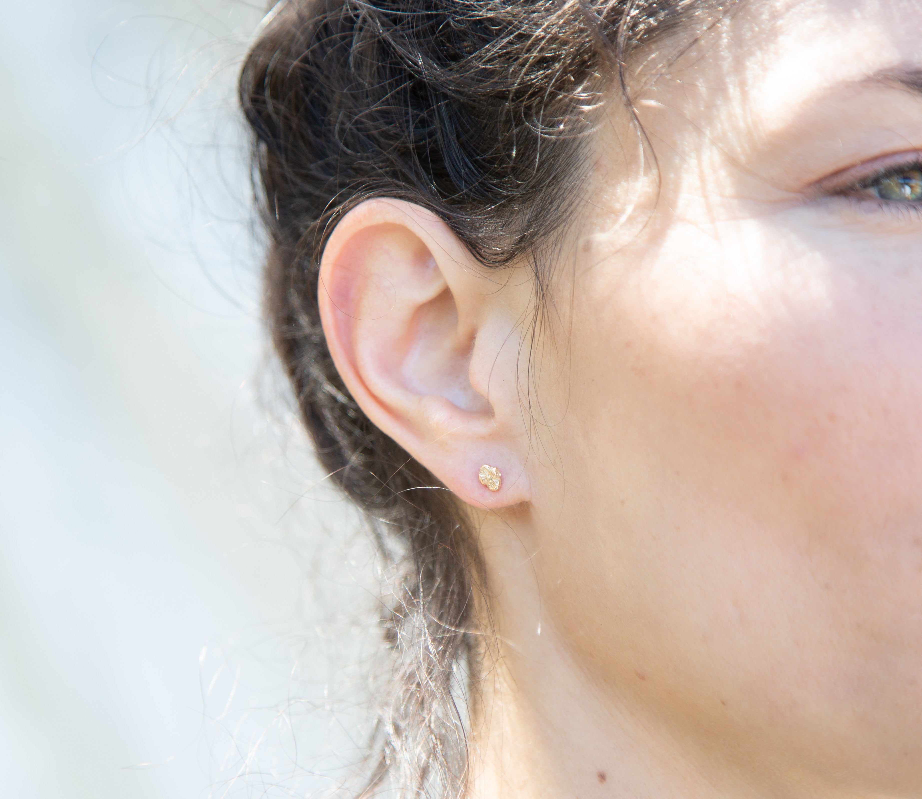 IDUN MINI Flower Stud Earrings worn on ear, sculptural lost wax cast detail